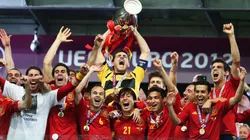 Iker Casillas (C) of Spain lifts the trophy as he celebrates with team-mates following victory in the UEFA EURO 2012 final match between Spain and Italy