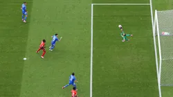 Image was captured using a remote camera positioned above the field of play) Gianluigi Donnarumma of Italy fails to save a shot from Ruben Vargas of Switzerland.