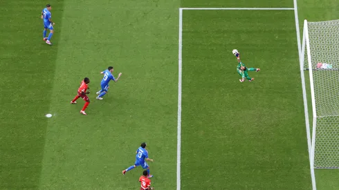 Image was captured using a remote camera positioned above the field of play) Gianluigi Donnarumma of Italy fails to save a shot from Ruben Vargas of Switzerland.