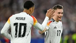 Florian Wirtz of Germany celebrates scoring his team's first goal with teammate Jamal Musiala during the UEFA EURO 2024 group stage match between Germany and Scotland
