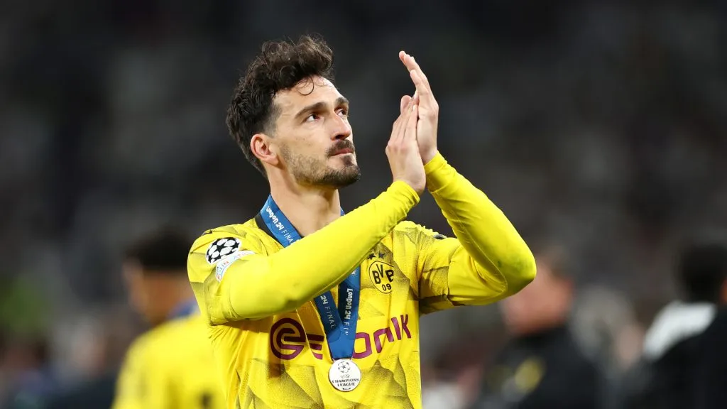 Mats Hummels of Borussia Dortmund applauds the fans, whilst wearing his runners up medal, after Real Madrid defeat Borussia Dortmund during the UEFA Champions League 2023/24 Final. Alex Pantling/Getty Images