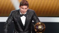 Lionel Messi of Argentina receives the FIFA Ballon d'Or 2012 trophy.
