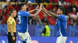 Alessandro Bastoni of Italy celebrates scoring his team's first goal with a header with teammate Lorenzo Pellegrini during the UEFA EURO 2024 group stage match between Italy and Albania.
