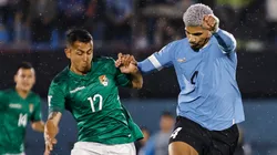Roberto Fernandez (L) of Bolivia struggles for the ball against Ronald Araujo (R) of Uruguay during the FIFA World Cup 2026 Qualifier match between Uruguay and Bolivia at Centenario Stadium on November 21, 2023 in Montevideo, Uruguay.