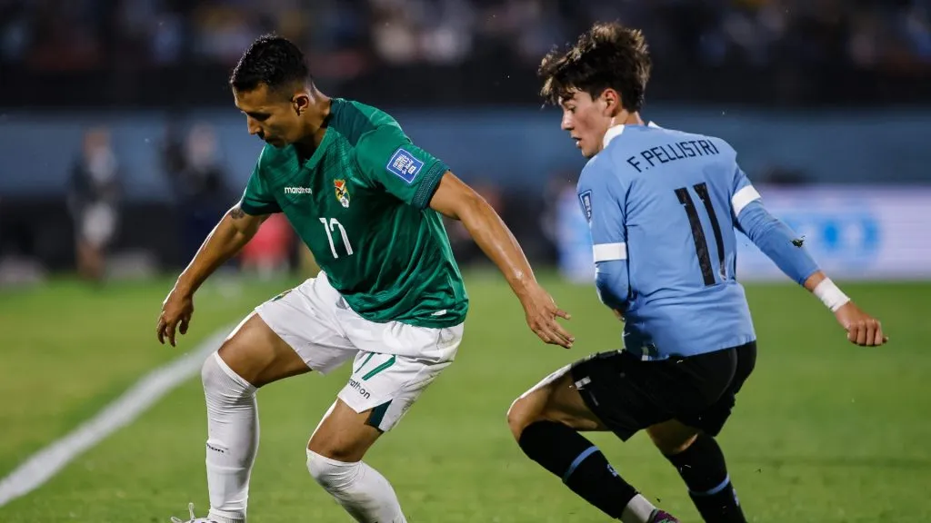 Roberto Fernandez (L) of Bolivia battles for the ball against Facundo Pellistri (R) of Uruguay during the FIFA World Cup 2026 Qualifier match between Uruguay and Bolivia at Centenario Stadium on November 21, 2023 in Montevideo, Uruguay.