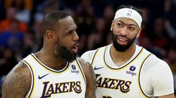 LeBron James #23 and Anthony Davis #3 of the Los Angeles Lakers stand on the court together during their game against the Golden State Warriors at Chase Center on January 27, 2024 in San Francisco, California.