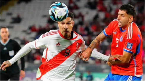 aolo Guerrero of Peru (L) and Guillermo Maripan of Chile (R)