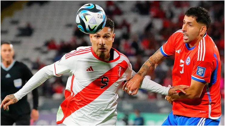 aolo Guerrero of Peru (L) and Guillermo Maripan of Chile (R)