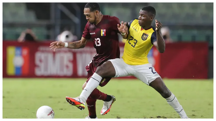 Jose Martinez of Venezuela and Moises Caicedo of Ecuador fight for the ball during a match between Venezuela and Ecuador