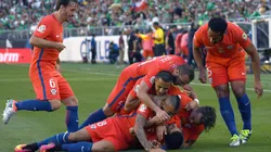 Edson Puch of Chile is piled on by teammates after he scored a goal against Mexico during the 2016 Copa America Quarterfinals