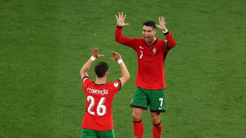 Cristiano Ronaldo of Portugal celebrates victory with teammate Francisco Conceicao after the UEFA EURO 2024 group stage match between Portugal and Czechia at Football Stadium Leipzig on June 18, 2024 in Leipzig, Germany.