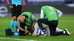 Kylian Mbappe of France receives medical treatment after clashing heads with Kevin Danso of Austria (not pictured) during the UEFA EURO 2024 group stage match between Austria and France at Düsseldorf Arena on June 17, 2024 in Dusseldorf, Germany.