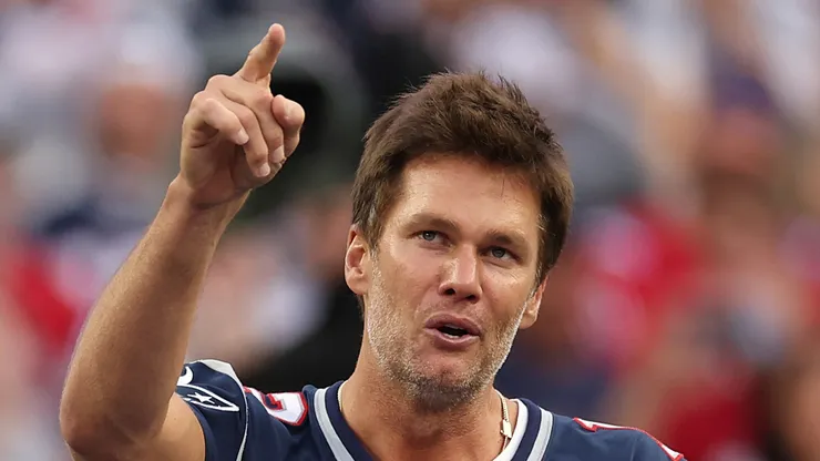 Former New England Patriots quarterback Tom Brady speaks during a ceremony honoring him at halftime of New England's game against the Philadelphia Eagles at Gillette Stadium on September 10, 2023 in Foxborough, Massachusetts.
