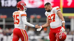 Patrick Mahomes #15 and Travis Kelce #87 of the Kansas City Chiefs high five during the first half against the New England Patriots at Gillette Stadium on December 17, 2023 in Foxborough, Massachusetts.