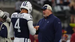 Head coach Mike McCarthy of the Dallas Cowboys interacts with Dak Prescott #4 of the Dallas Cowboys prior to the game against the Washington Commanders at AT&T Stadium on November 23, 2023 in Arlington, Texas.