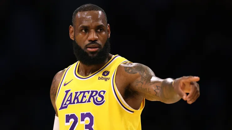 LeBron James #23 of the Los Angeles Lakers directs the defense during a 129-125 loss to the Golden State Warriors in a preseason game at Crypto.com Arena on October 13, 2023 in Los Angeles, California.