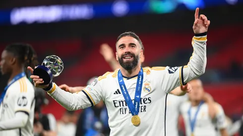 Daniel Carvajal of Real Madrid celebrates victory with his PlayStation Player of the Match award after Real Madrid defeat Borussia Dortmund during the UEFA Champions League 2023/24 Final match between Borussia Dortmund and Real Madrid CF at Wembley Stadium on June 01, 2024 in London, England.