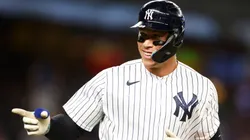 Aaron Judge #99 of the New York Yankees points to the dugout after hitting his third home run of the game against the Washington Nationals at Yankee Stadium on August 23, 2023 in the Bronx borough of New York City.
