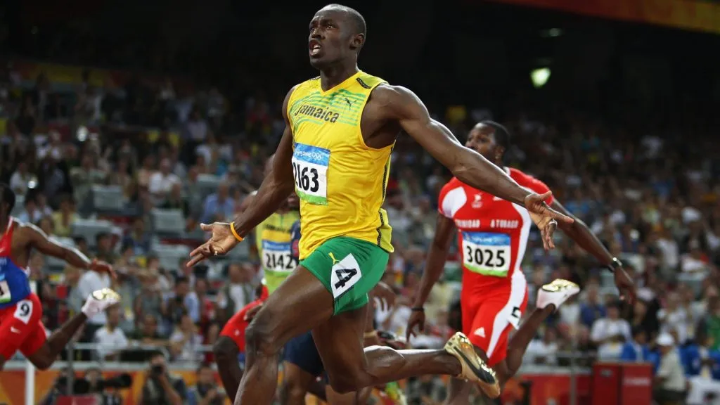 Usain Bolt of Jamaica celebrates as he crosses the line to win the Men’s 100m Final at the National Stadium on Day 8 of the Beijing 2008 Olympic Games on August 16, 2008 in Beijing, China. Bolt clocked a new world record time of 9.69 seconds. (Photo by Mark Dadswell/Getty Images)