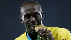 Gold medalist Usain Bolt of Jamaica stands on the podium during the medal ceremony for the Men's 4 x 100 meter Relay on Day 15 of the Rio 2016 Olympic Games at the Olympic Stadium on August 20, 2016 in Rio de Janeiro, Brazil.
