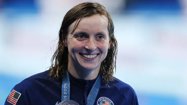 Katie Ledecky of Team United States poses with her medal following the Medal Ceremony after the Women's 400m Freestyle Final on day one of the Olympic Games Paris 2024.