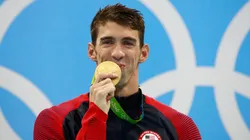 Gold medalist Michael Phelps of the United States celebrates on the podium during the medal ceremony for the Men's 200m Individual Medley Final of the Rio 2016 Olympic Games.