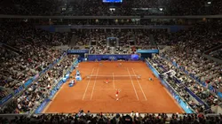 A general view as Rafael Nadal serves with partner Carlos Alcaraz of Team Spain against Andres Molteni and Maximo Gonzalez of Team Argentina during the Men's Doubles first round match on day one of the Olympic Games Paris 2024