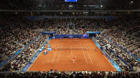 A general view as Rafael Nadal serves with partner Carlos Alcaraz of Team Spain against Andres Molteni and Maximo Gonzalez of Team Argentina during the Men's Doubles first round match on day one of the Olympic Games Paris 2024