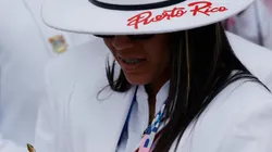 An athlete from Puerto Rico checks her smartphone as athletes from Puerto Rico's delegation prepare to board a boat to sail along the river Seine during the Opening Ceremony of the Olympic Games Paris 2024 on July 26, 2024 in Paris, France.