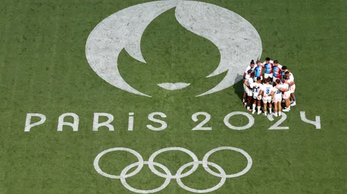 Players of Team France enter a huddle prior to the Men's Rugby Sevens Pool C Group match between France and United States on Day -2 of the Olympic Games Paris 2024 at Stade de France on July 24, 2024 in Paris, France.