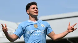 Julian Alvarez of Manchester City celebrates scoring his team's fourth goal during the Premier League match between Fulham FC and Manchester City at Craven Cottage on May 11, 2024 in London, England.