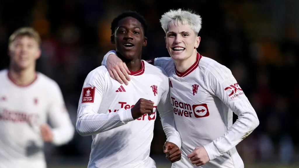 Kobbie Mainoo celebrates with Alejandro Garnacho after scoring his team’s second goal during the Emirates FA Cup Fourth Round match between Newport County and Manchester United. Ryan Hiscott/Getty Images
