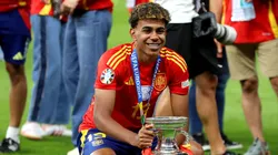 Lamine Yamal of Spain celebrates with the UEFA Euro 2024 Henri Delaunay Trophy after his team's victory in the UEFA EURO 2024 final match between Spain and England at Olympiastadion on July 14, 2024 in Berlin, Germany.