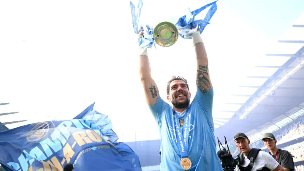 Stefan Ortega of Manchester City celebrates with the Premier League Trophy after their team’s victory in the Premier League match between Manchester City and West Ham United at Etihad Stadium. Michael Regan/Getty Images
