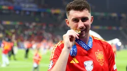 Aymeric Laporte of Spain bites his winners medal after victory over England in the UEFA EURO 2024 final match between Spain and England at Olympiastadion on July 14, 2024 in Berlin, Germany.