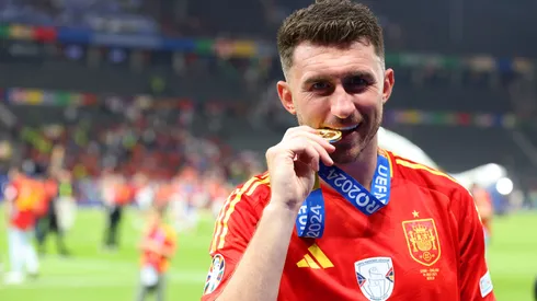 Aymeric Laporte of Spain bites his winners medal after victory over England in the UEFA EURO 2024 final match between Spain and England at Olympiastadion on July 14, 2024 in Berlin, Germany.