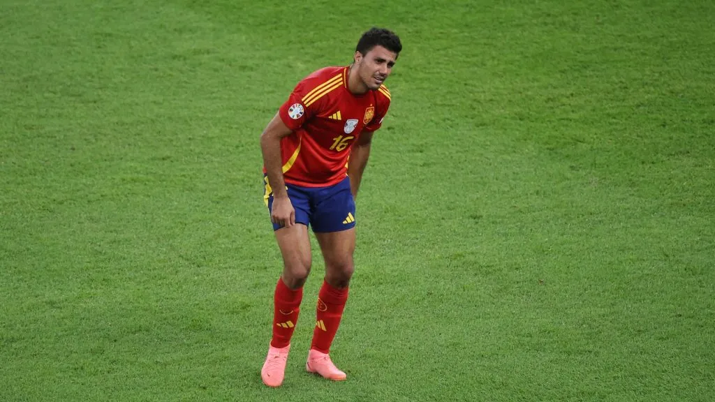 Rodri of Spain reacts as he holds his leg during the UEFA EURO 2024 final match between Spain and England at Olympiastadion on July 14, 2024 in Berlin, Germany. Photo by Alex Grimm/Getty Images