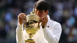 Carlos Alcaraz of Spain kisses the Gentlemen's Singles Trophy following victory against Novak Djokovic of Serbia in the Gentlemen's Singles Final during day fourteen of The Championships Wimbledon 2024 at All England Lawn Tennis and Croquet Club on July 14, 2024 in London, England.