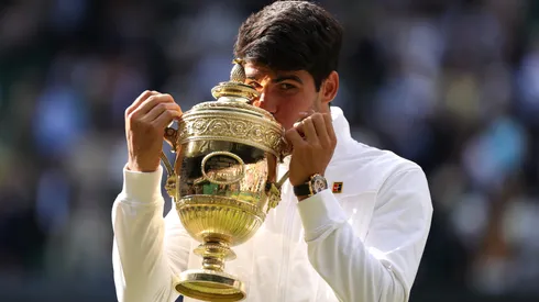 Carlos Alcaraz of Spain kisses the Gentlemen's Singles Trophy following victory against Novak Djokovic of Serbia in the Gentlemen's Singles Final during day fourteen of The Championships Wimbledon 2024 at All England Lawn Tennis and Croquet Club on July 14, 2024 in London, England.