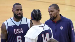 LeBron James #6, Anthony Davis #14 and Kevin Durant #7 of the 2024 USA Basketball Men's National Team talk during a practice session at the team's training camp at the Mendenhall Center at UNLV on July 07, 2024 in Las Vegas, Nevada.