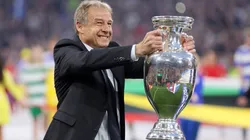 Jurgen Klinsmann, German former professional player and manager, holds the UEFA Euro 2024 Henri Delaunay Trophy prior to kick-off ahead of the UEFA EURO 2024