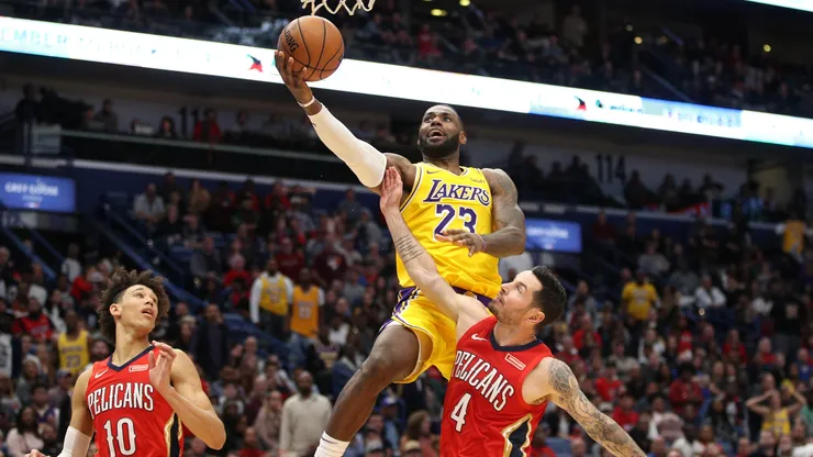 LeBron James #23 of the Los Angeles Lakers shoots the ball over JJ Redick #4 of the New Orleans Pelicans at Smoothie King Center on November 27, 2019.