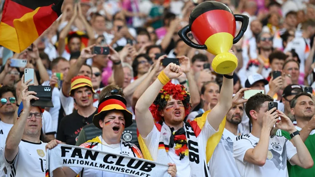 A fan of Germany holds up an inflatable trophy as he enjoys the pre match atmosphere with fans prior to the UEFA EURO 2024 group stage match between Germany and Hungary. Photo by Shaun Botterill/Getty Images