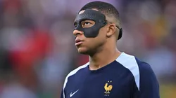 France player Kylian Mbappe in his mask looks on before the UEFA EURO 2024 quarter-final match between Portugal and France.