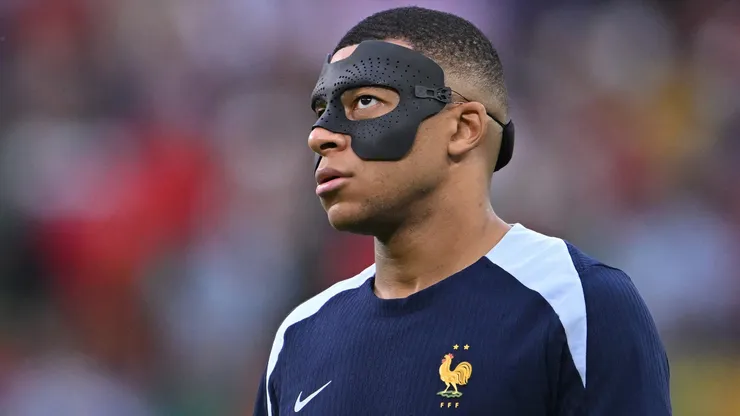 France player Kylian Mbappe in his mask looks on before the UEFA EURO 2024 quarter-final match between Portugal and France.