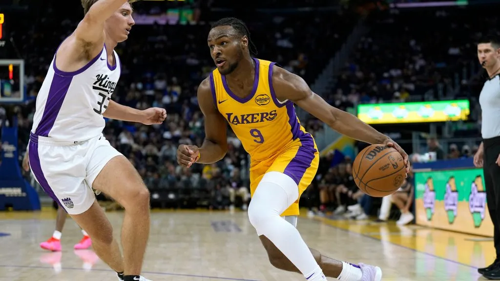 Bronny James Jr. #9 of the Los Angeles Lakers drives to the basket on Dane Goodwin #33 of the Sacramento Kings during a summer league game. (Thearon W. Henderson/Getty Images)
