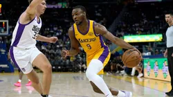 Bronny James Jr. #9 of the Los Angeles Lakers drives to the basket on Dane Goodwin #33 of the Sacramento Kings during the second half of a 2024 California Classic summer league game at Chase Center