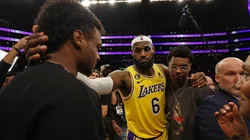 LeBron James #6 of the Los Angeles Lakers reacts with Bronny James and Bryce James after scoring to pass Kareem Abdul-Jabbar to become the NBA's all-time leading scorer, surpassing Abdul-Jabbar's career total of 38,387 points against the Oklahoma City Thunder.