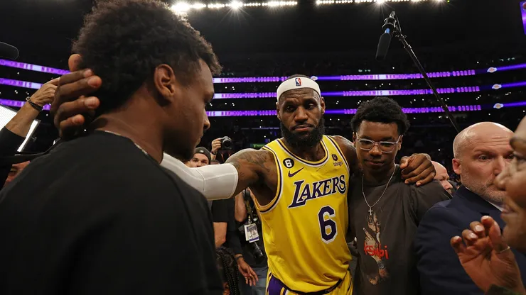 LeBron James #6 of the Los Angeles Lakers reacts with Bronny James and Bryce James after scoring to pass Kareem Abdul-Jabbar to become the NBA's all-time leading scorer, surpassing Abdul-Jabbar's career total of 38,387 points against the Oklahoma City Thunder.