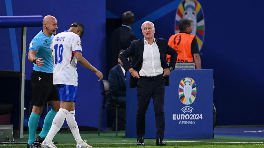idier Deschamps, Head Coach of France, looks on as Kylian Mbappe of France walks down the touchline after he receives medical treatment during the UEFA EURO 2024 quarter-final match between Portugal and France at Volksparkstadion on July 05, 2024 in Hamburg, Germany. Photo by Stu Forster/Getty Images